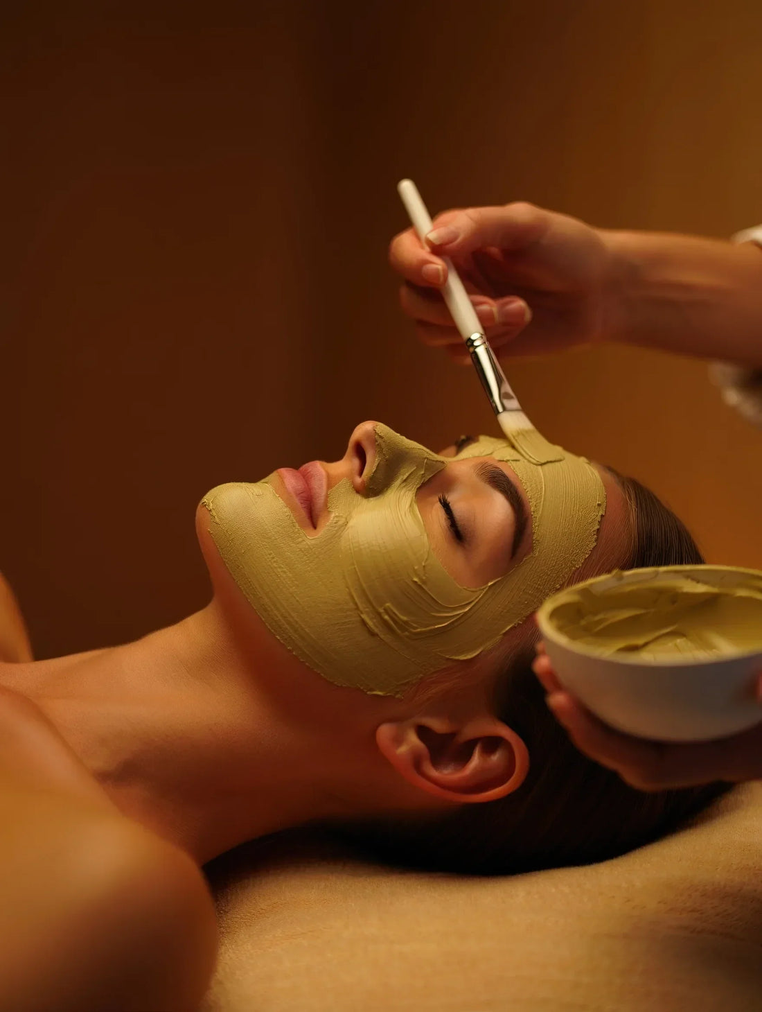 Woman applying Multani Mitti clay mask as mindful self-care skincare ritual