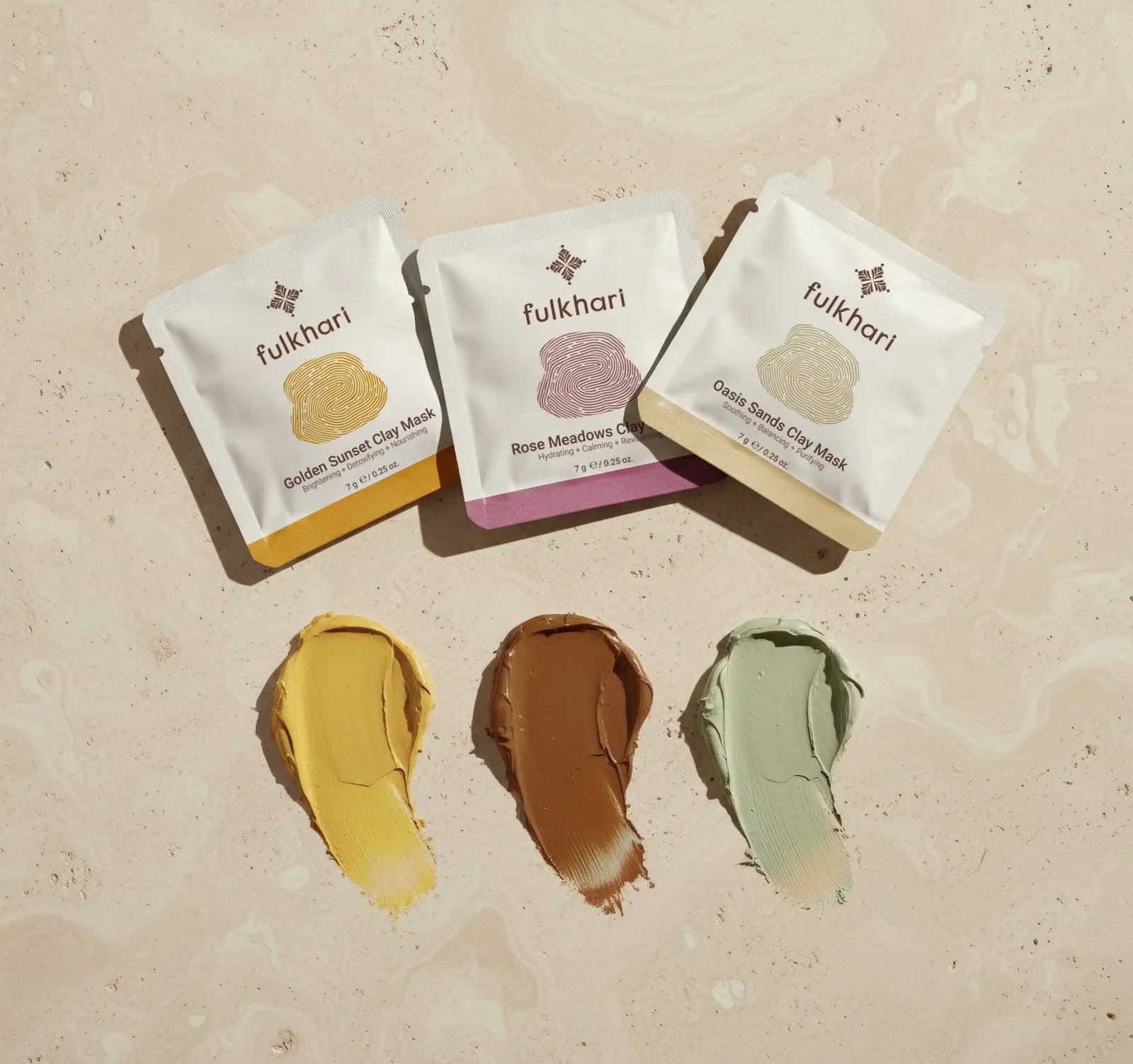 Fulkhari Multani Mitti sampler set showing three open sachets and rich clay textures, perfect for trialing the complete ancient detox ritual.