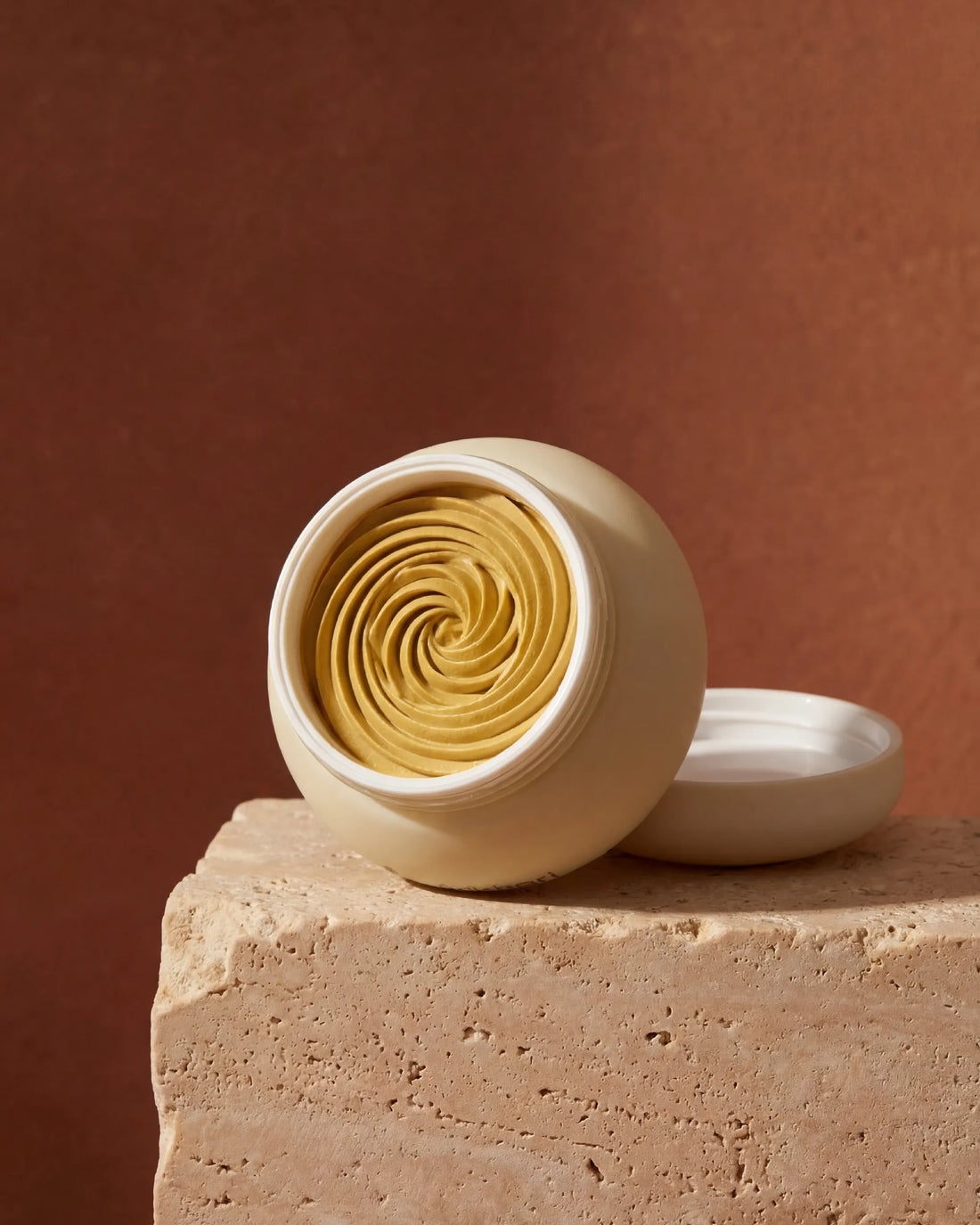 Open jar showing the whipped, concentric texture of the Golden Sunset Multani Mitti face mask.