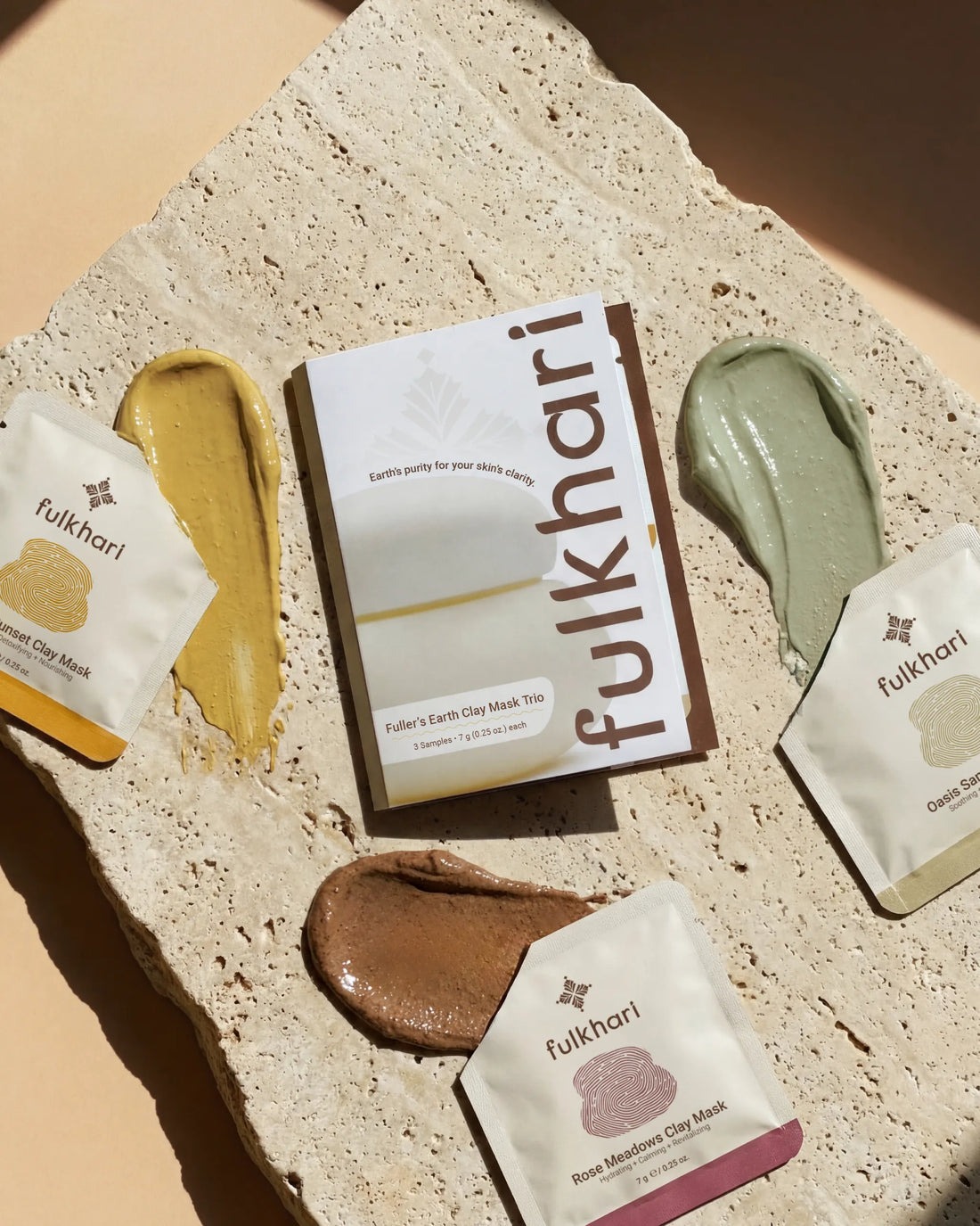  Open sachets of Fulkhari Multani Mitti face masks showing the rich clay texture of the brightening, hydrating, and purifying formulas.