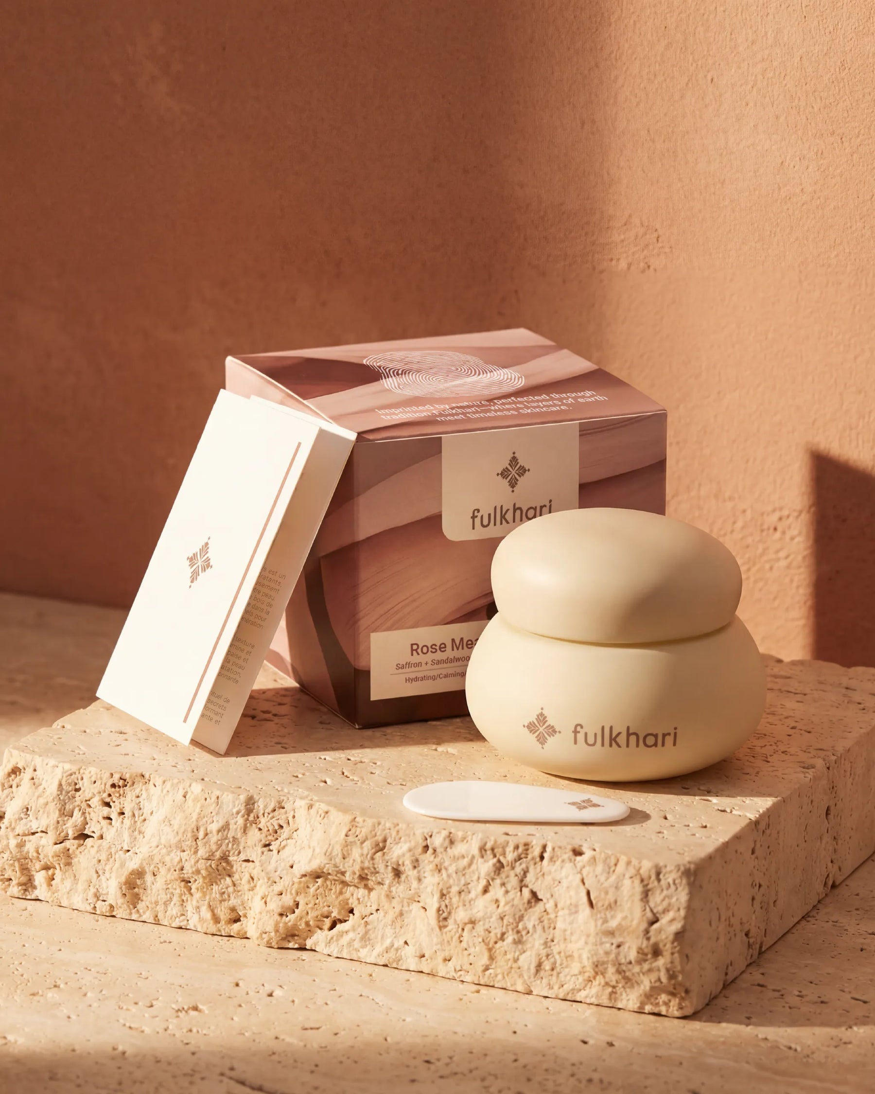 Fulkhari Rose Meadows skincare packaging set featuring the Multani Mitti clay jar and spoon.
