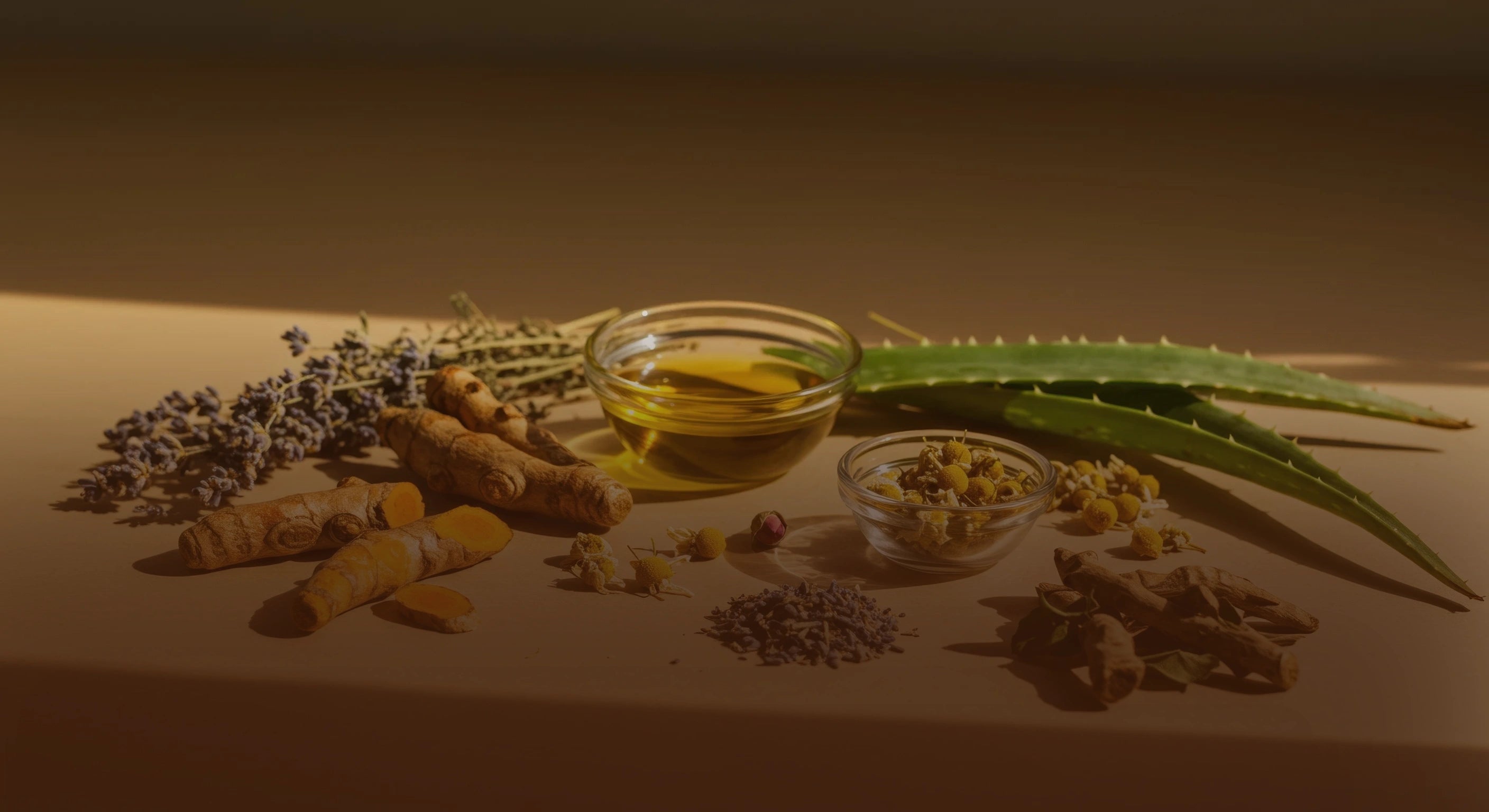 Herbal ingredients including turmeric, lavender, and aloe vera on a wooden surface.