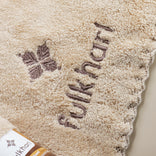 Close-up of the non-abrasive, breathable cotton weave of the TerraPlush skincare towel.